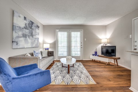 a living room with a couch and a tv