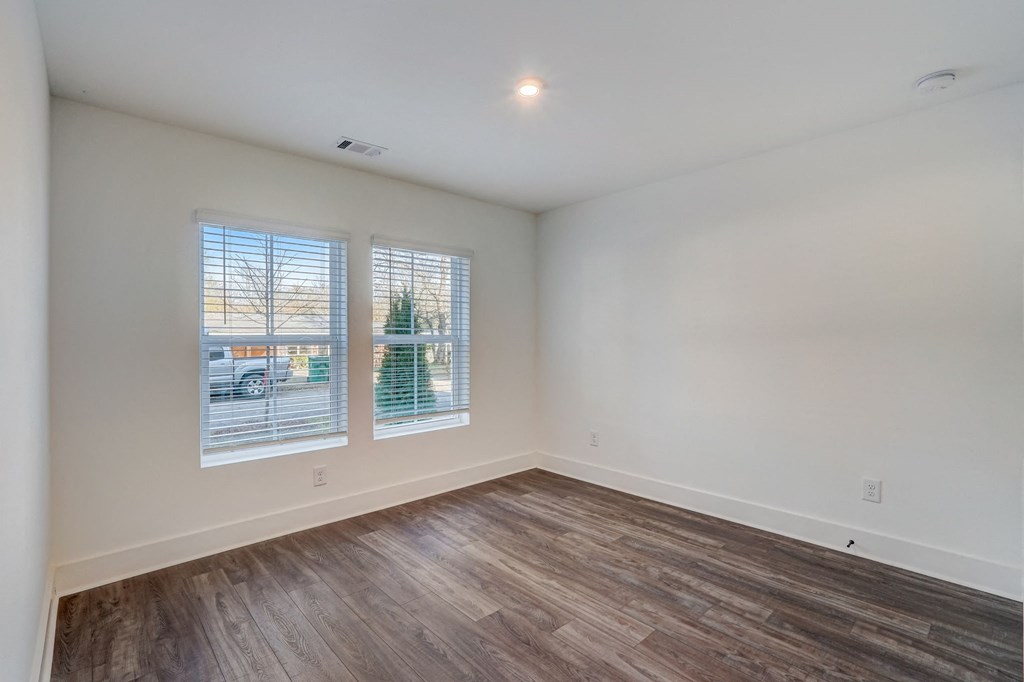 Henley Avondale Homes for rent in Avondale Estates, GA photo of the living room of a new home with wood flooring and windows