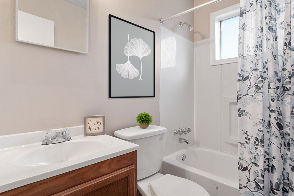 Bathroom with tub and shower at Mableton Ridge Apartments in Mableton, GA, near Douglasville.