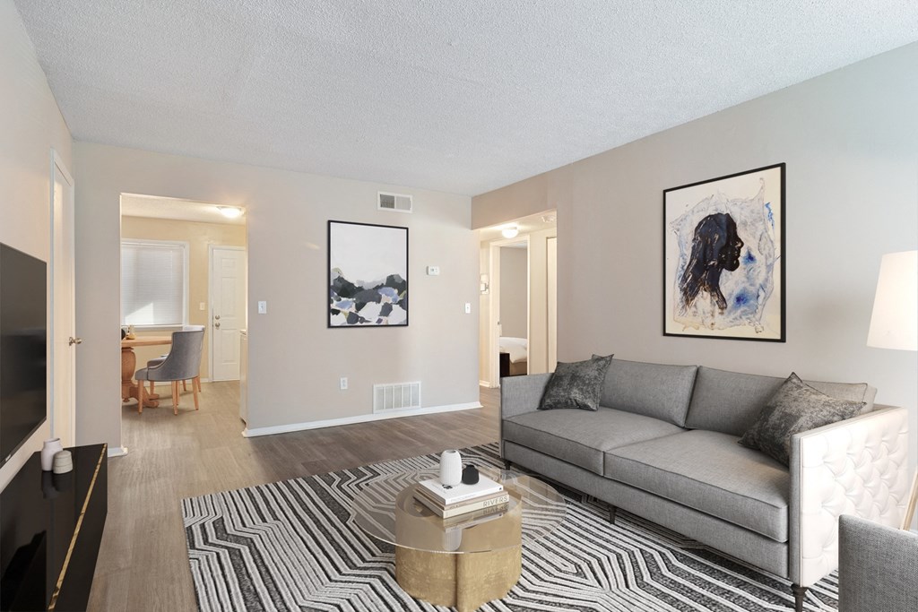 Spacious living room with large window in a pet-friendly apartment at Mableton Ridge Apartments in Mableton, GA, near Douglasville.