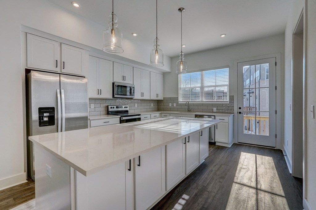 Henley Avondale Homes for rent in Avondale Estates, GA photo of a large kitchen with white cabinets and a white counter top