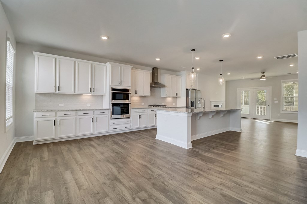 a kitchen and living room in a new home