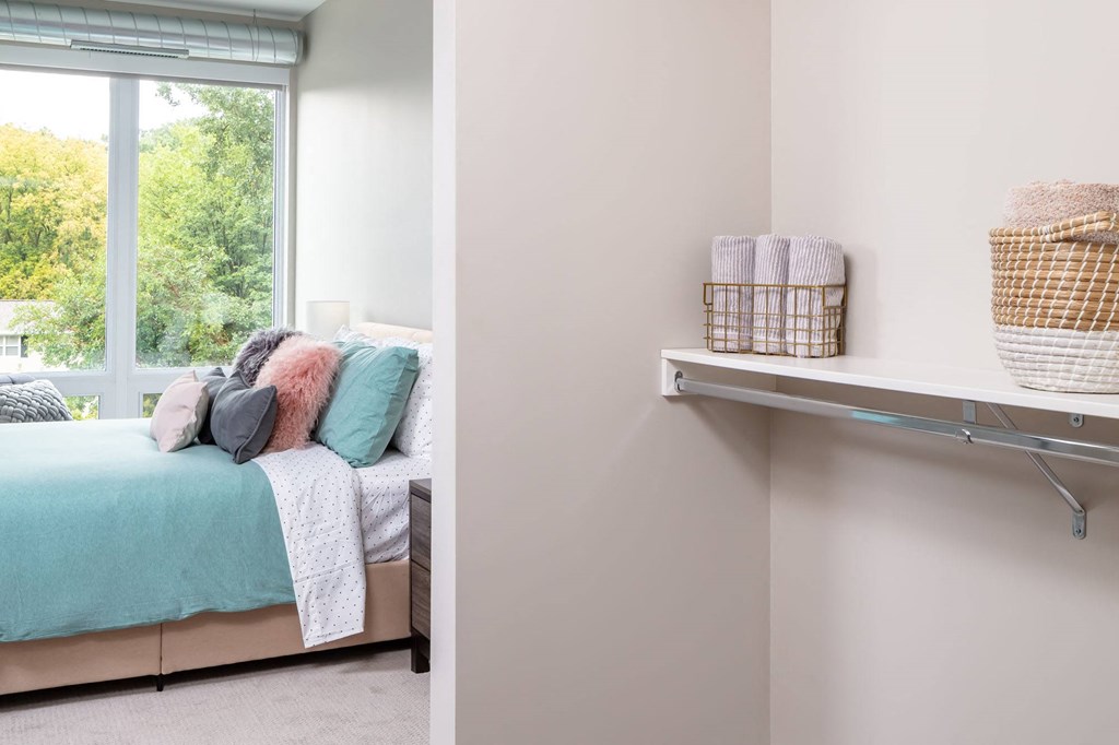 a bedroom with a bed and a window