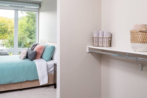 a bedroom with a bed and a window