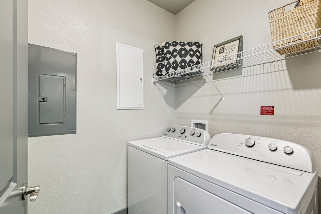 Full-size washer and dryer unit in laundry area at Lotus at Starkey Ranch in Odessa, Florida.