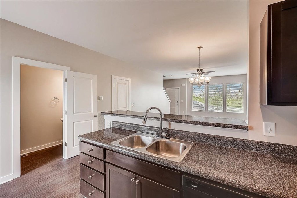 a kitchen with a sink and a window