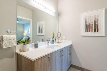 a bathroom with a sink and a mirror - Photo Gallery 31