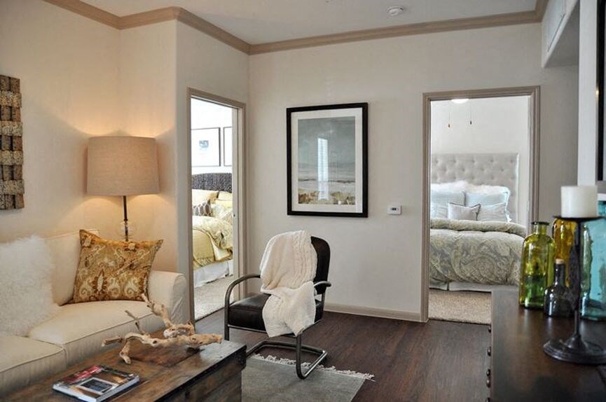 Living room with doors to bedrooms and wood floor