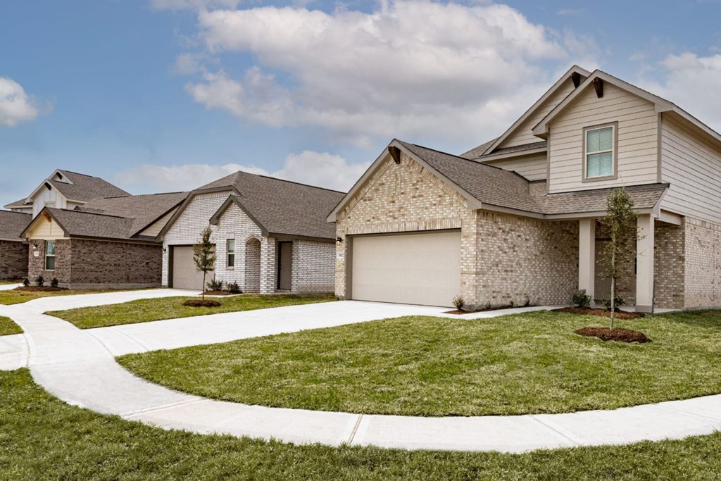 a home with a walkway in front of it