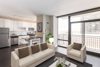 living room with large balcony window - Photo Gallery 3