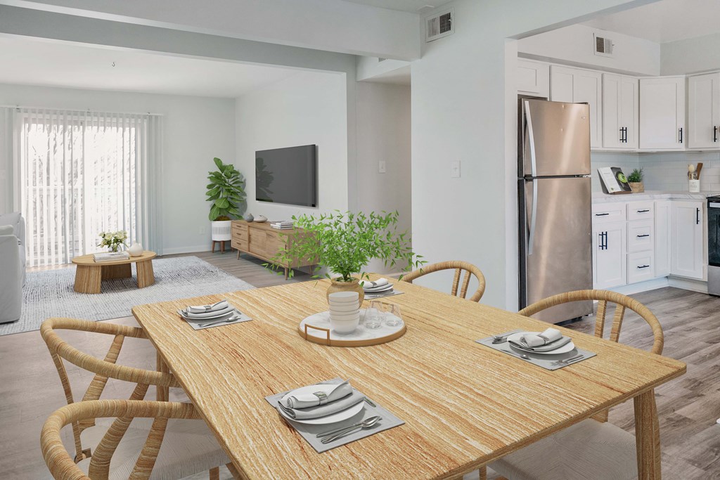 a kitchen and dining room with a table and chairs