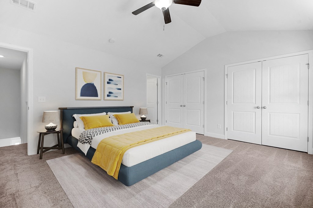 Cottonvale Towns in Savannah, GA photo of a bedroom with a bed and a ceiling fan