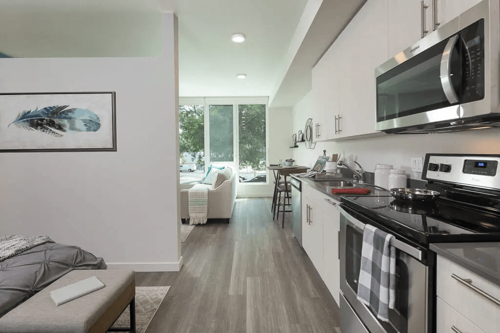 a kitchen with a stove and a microwave