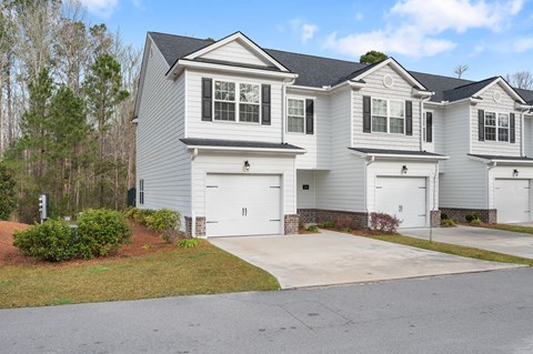 Harris Trail Luxury Townhomes for rent Richmond Hill, GA photo of white townhome with garage