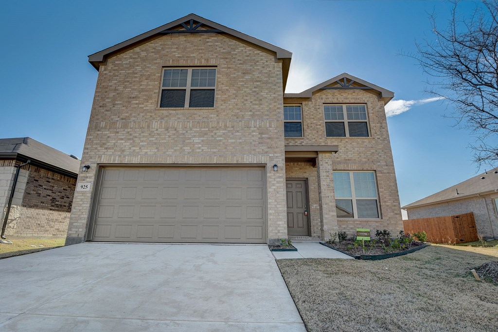 a house with a garage door in front of it