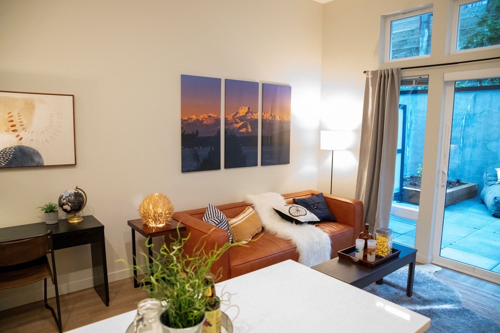 1-Bedroom Apartments In Bothell, WA - Morado Bothell - Cozy Living Room With Luxury Vinyl Plank Flooring, Large Windows & Natural Lighting With Street Noise Reduction, And 9' Ceilings.