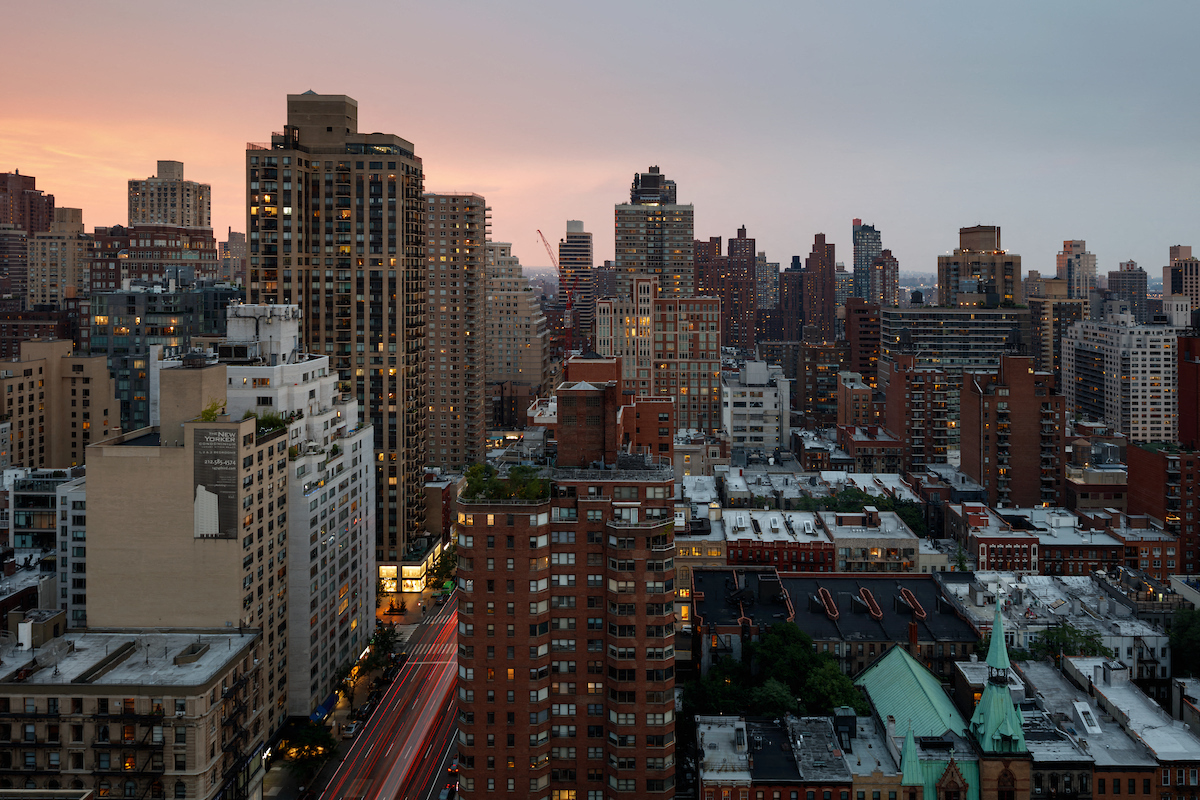 an aerial view of the city at sunset