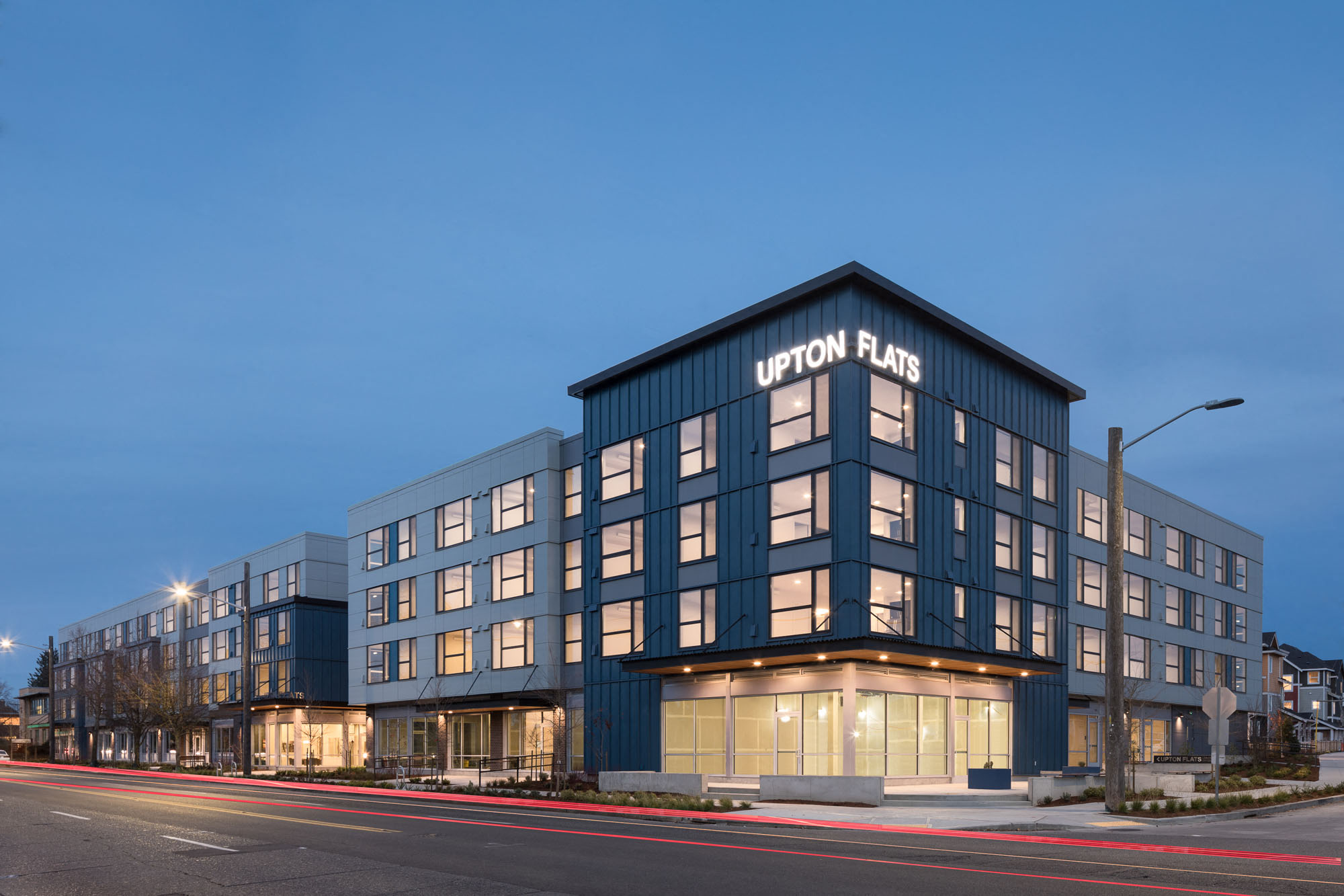 Apartments in West Seattle, WA For Rent - Upton Flats - Building Exterior from Street View at Dusk