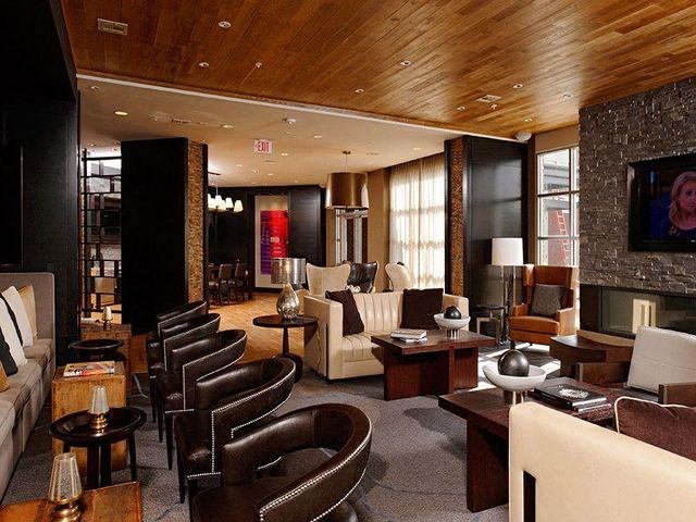 Lounge with multiple seating areas and large windows