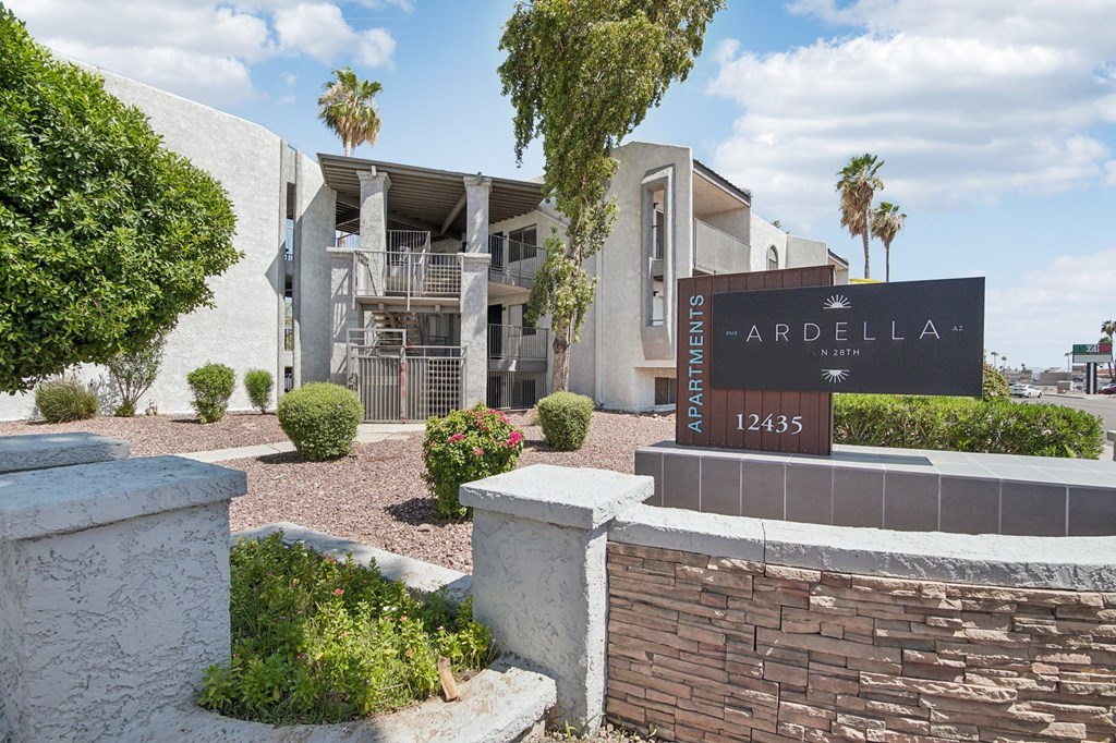 The image shows a building with a sign that reads "Ardella Apartments 12435".