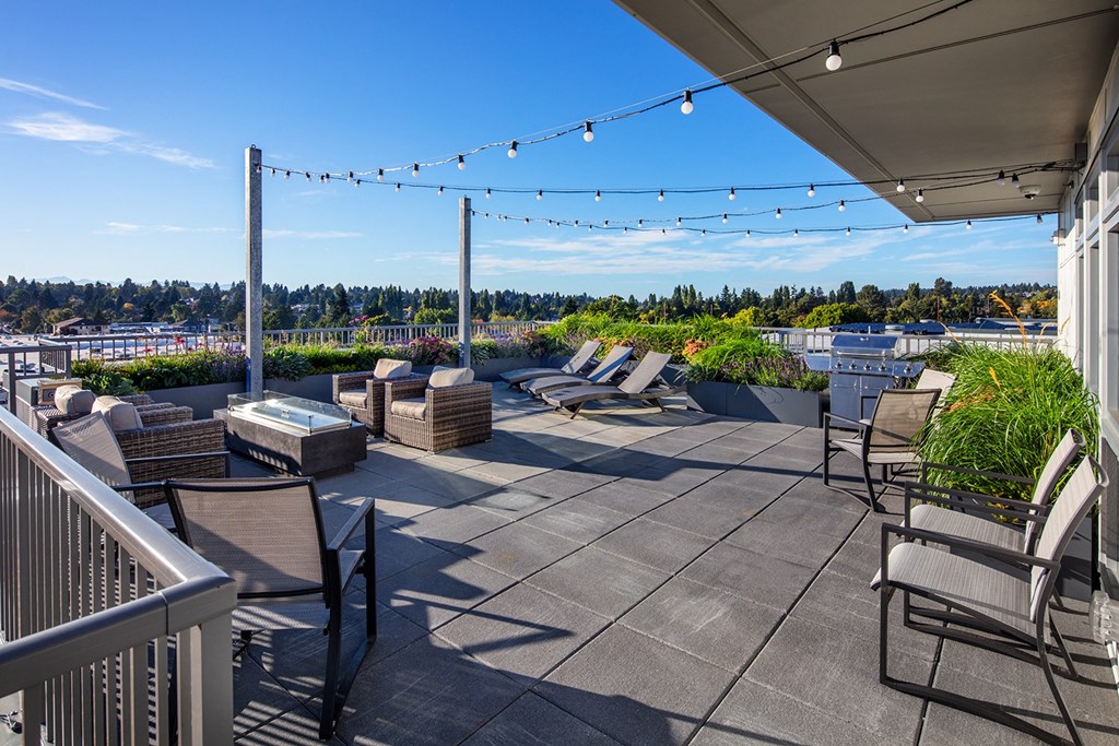 rooftop deck with BBQ and sitting areas