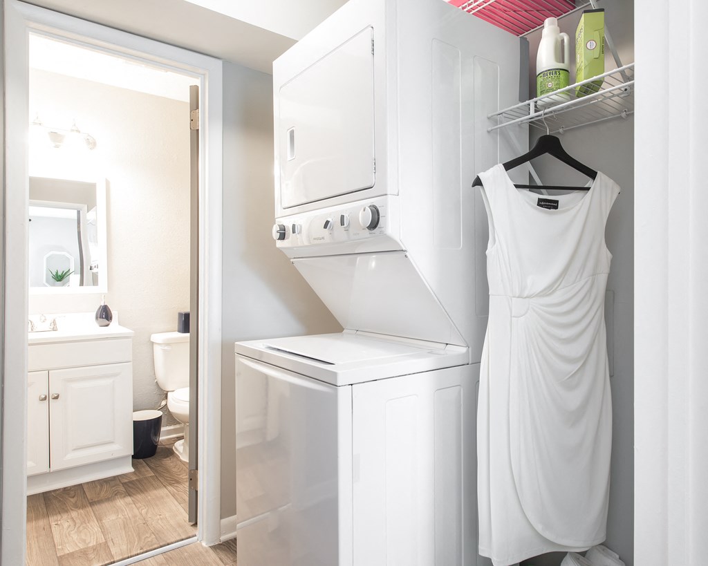 Sandy Springs, GA Apartments – Celebration at Sandy Springs - a small laundry room with a washer and dryer
