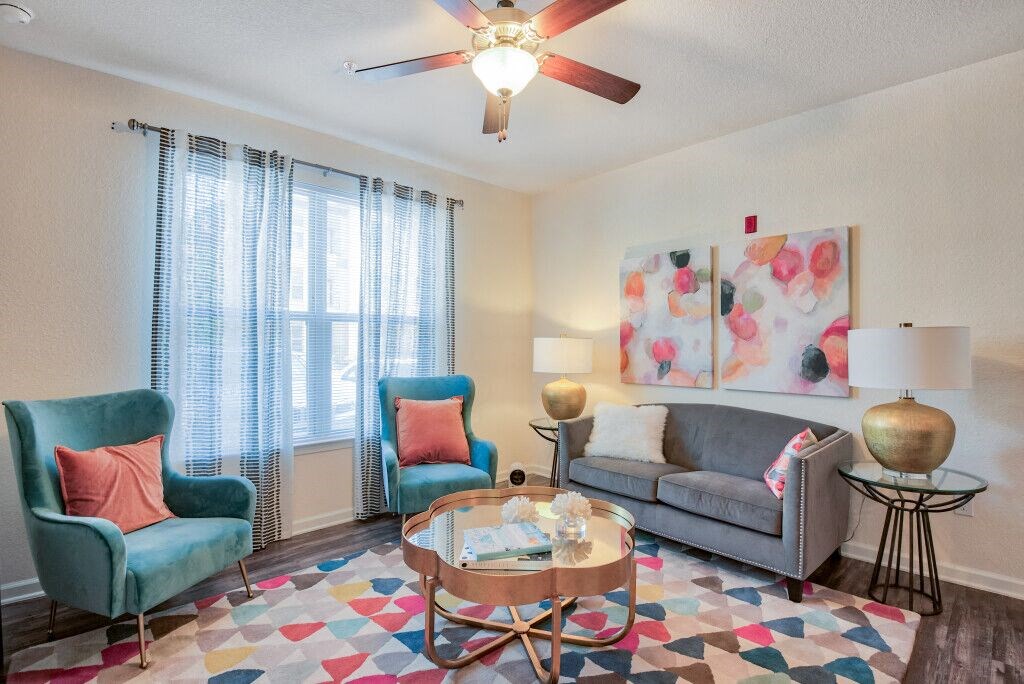 Apartments for Rent in Tallahassee, FL - Apalachee Point - Living Room Area with Large Windows and Ceiling Fan