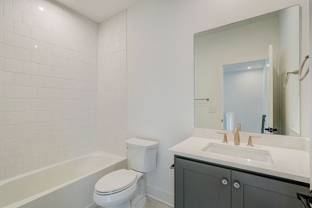 Henley Avondale Homes for rent in Avondale Estates, GA photo of a bathroom with a sink toilet and a mirror