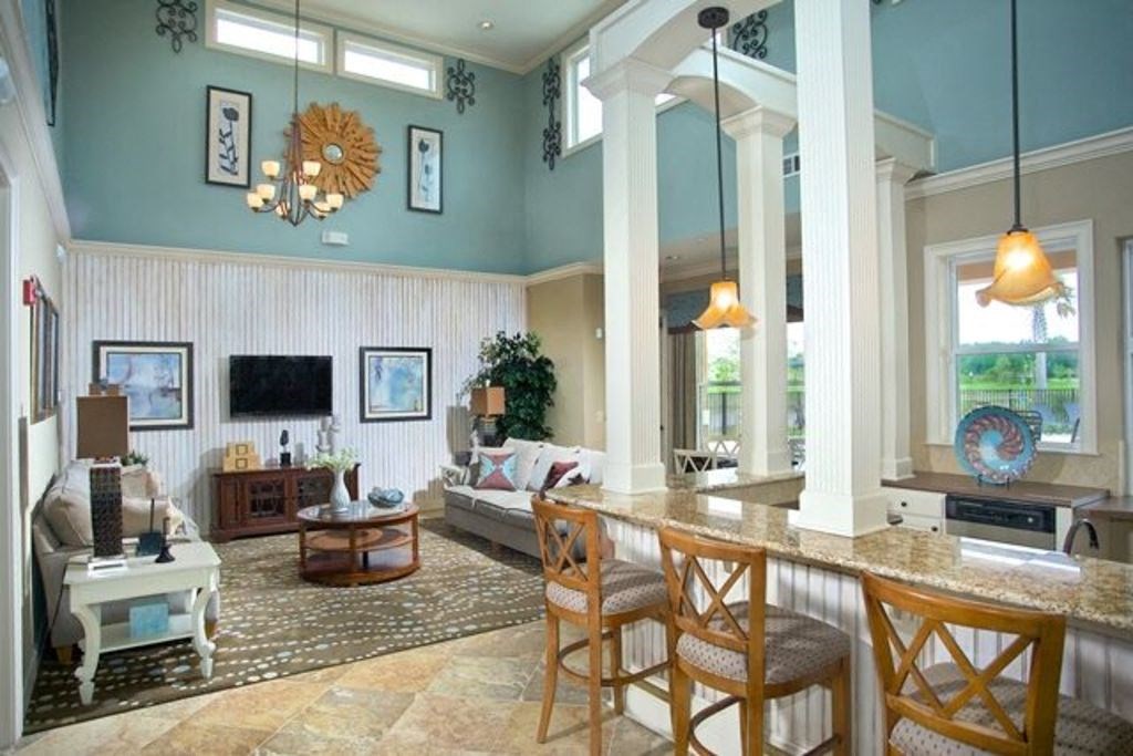 Hinesville, GA Apartments – Tattersall Village - clubhouse with sitting are and TV and bar area