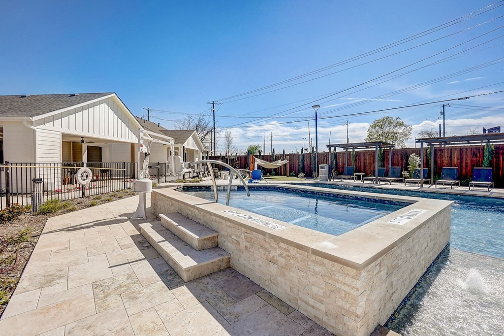 the preserve at ballantyne commons pool and spa with a house with a pool