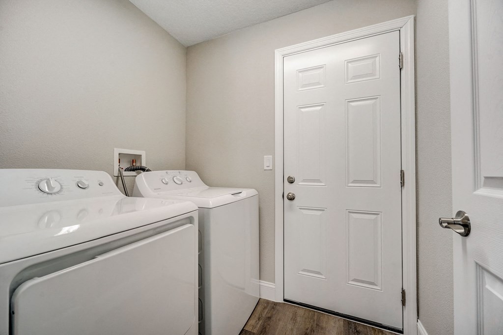 In-unit washer and dryer at The Groves at Lake Ella in Lady Lake, Florida, a pet-friendly rental community.