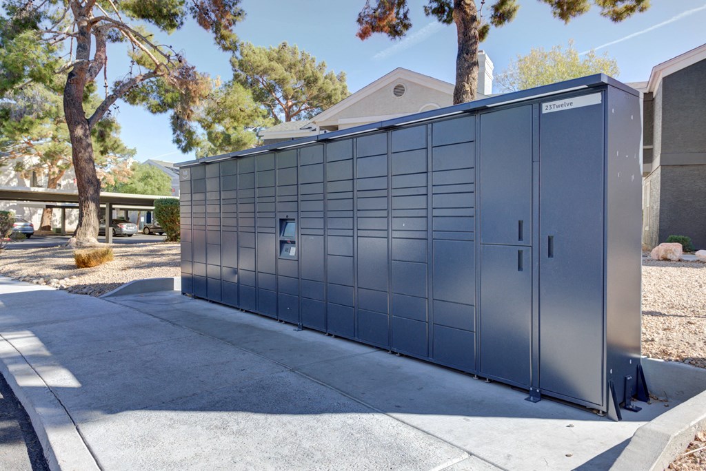 a small metal building on the side of a sidewalk