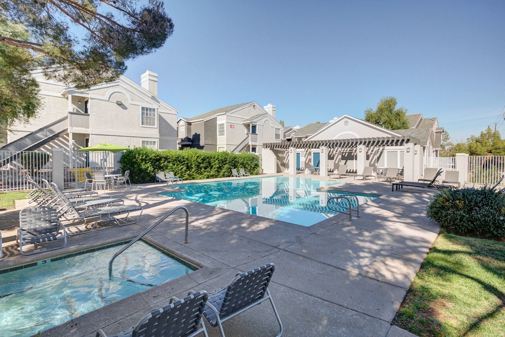 our apartments have a swimming pool and a patio with chairs