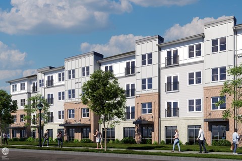 A row of modern apartment buildings with people walking in front.