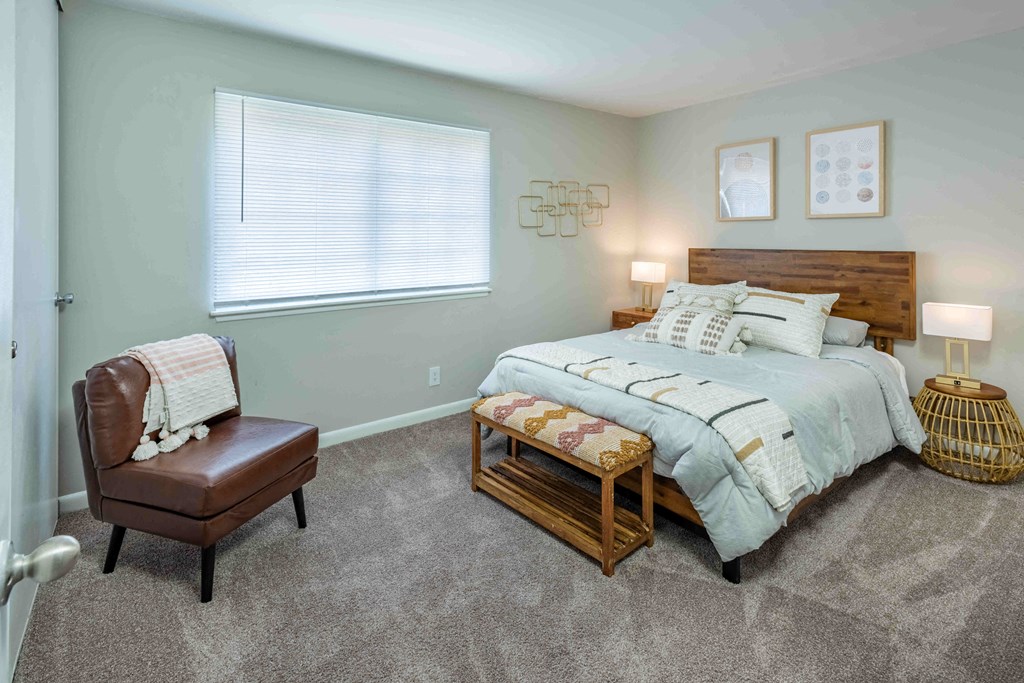 Grand Arbor Reserve Apartments in Raleigh, NC photo of a bedroom with plus hcarpeting and a large window