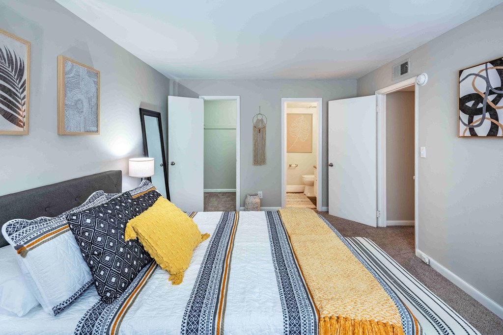 Grand Arbor Reserve Apartments in Raleigh, NC photo of a bedroom with an attached bathroom and walkin closet