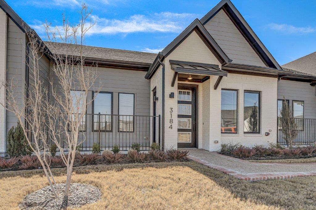 Arlington TX Rental Homes Near AT&T Stadium - Legacy Park at Viridian - Home Exterior with Many Windows and Beautiful Landscaping