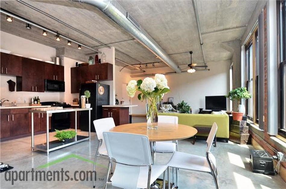 a table with a vase of flowers on top of it