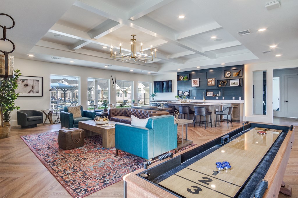 A billiard table is in the middle of a living room.