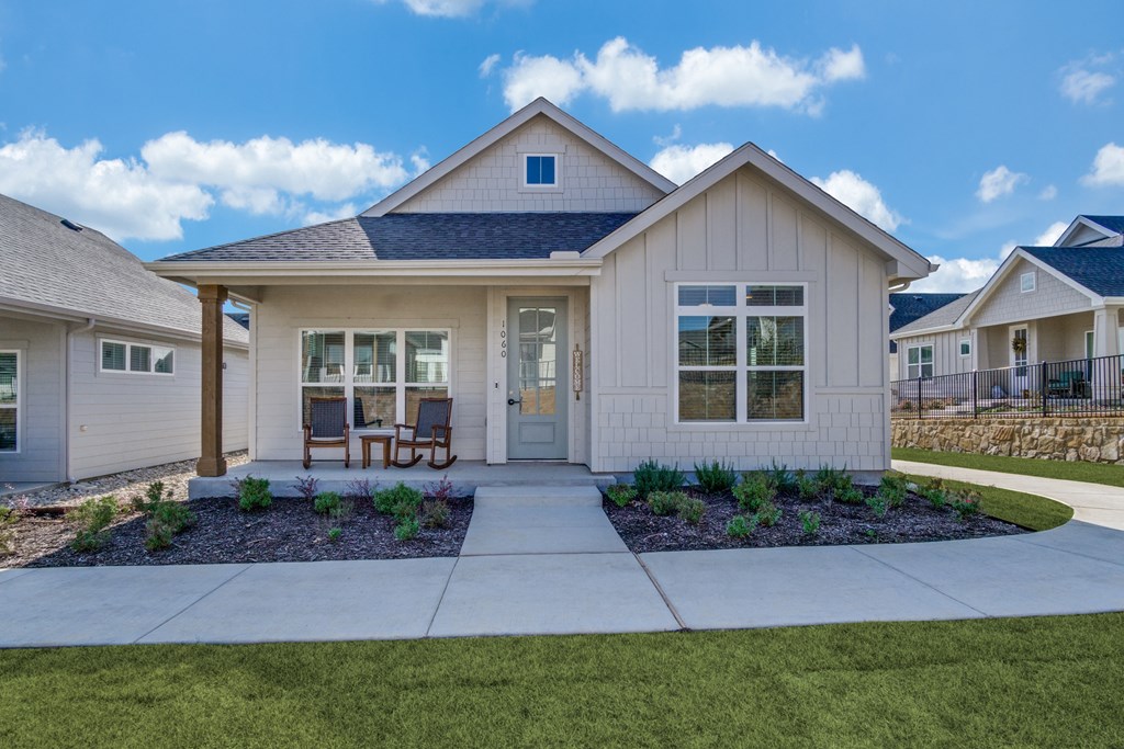 A house with a front yard and a small garden.