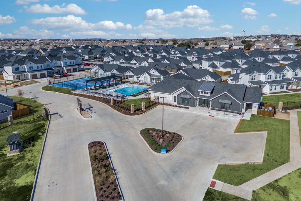 A residential area with houses and a swimming pool.