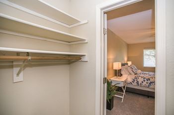 a bedroom with a bed and a mirror