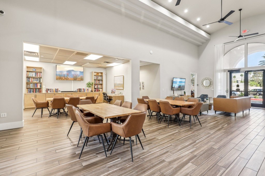 A room with a long table and chairs.