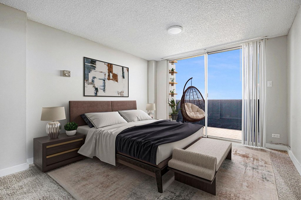 an image of a bedroom with a bed and a large window