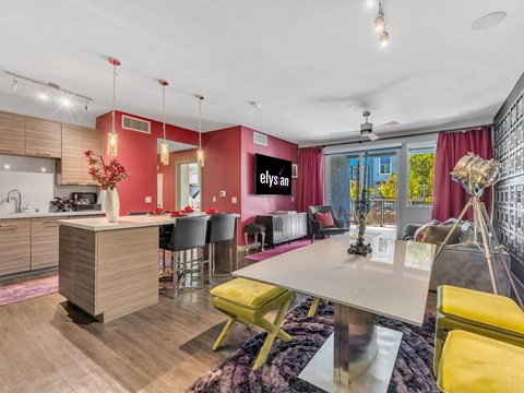 A modern kitchen with a dining table and chairs.