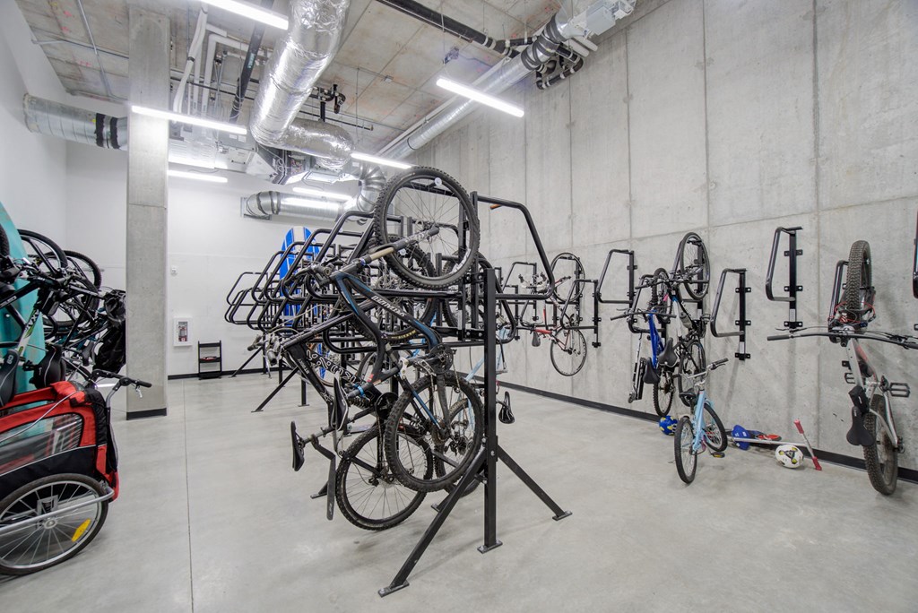 a room filled with bikes and other bikes on stands in a room with other bikes