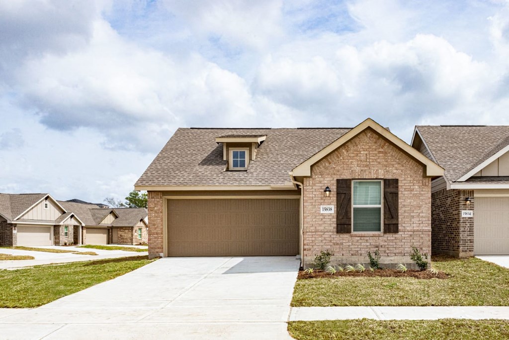 a home with a brown garage door