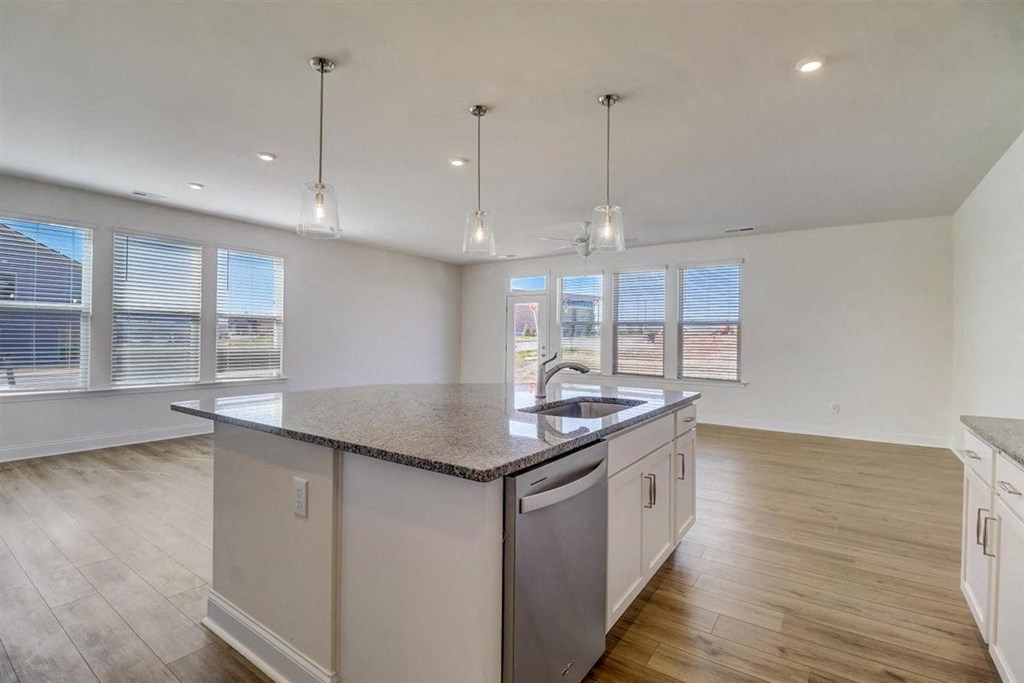a kitchen and living room with a large island