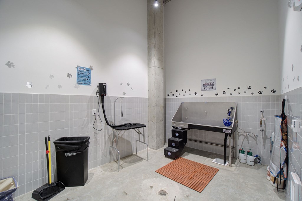 a bathroom with a sink and a chair in it