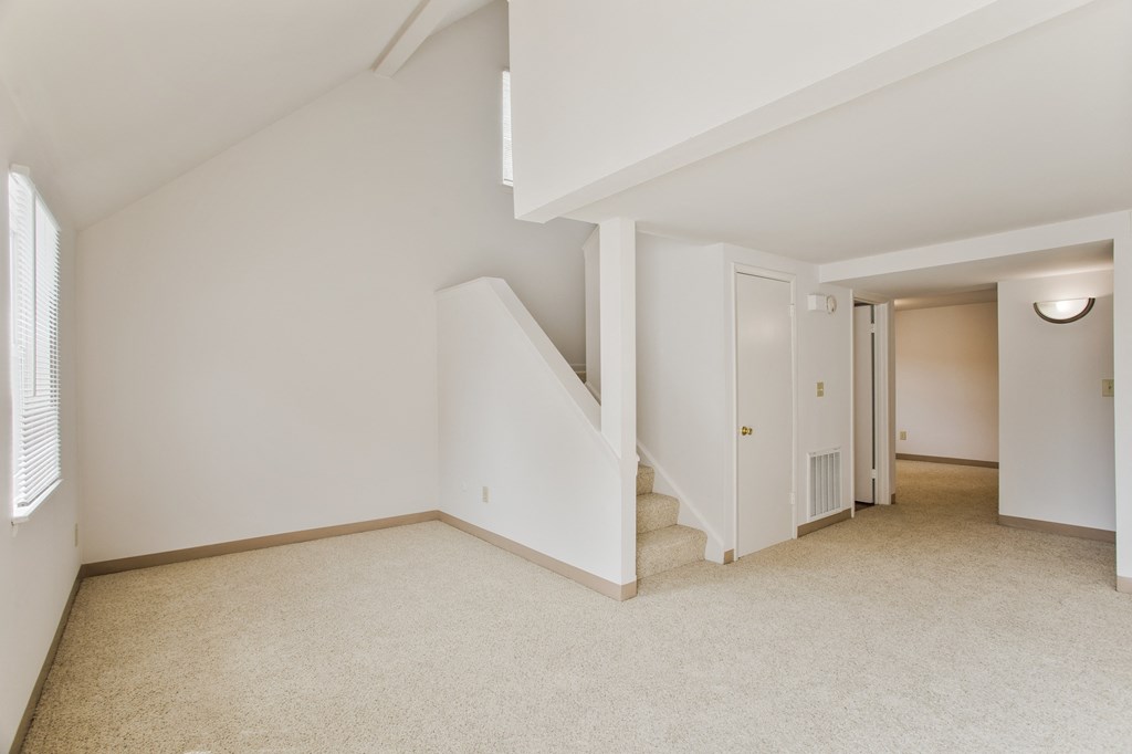 renovated living room with loft and stairs